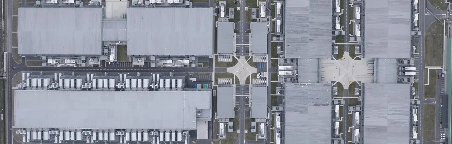 Top-down aerial view of data centre roofs and plant