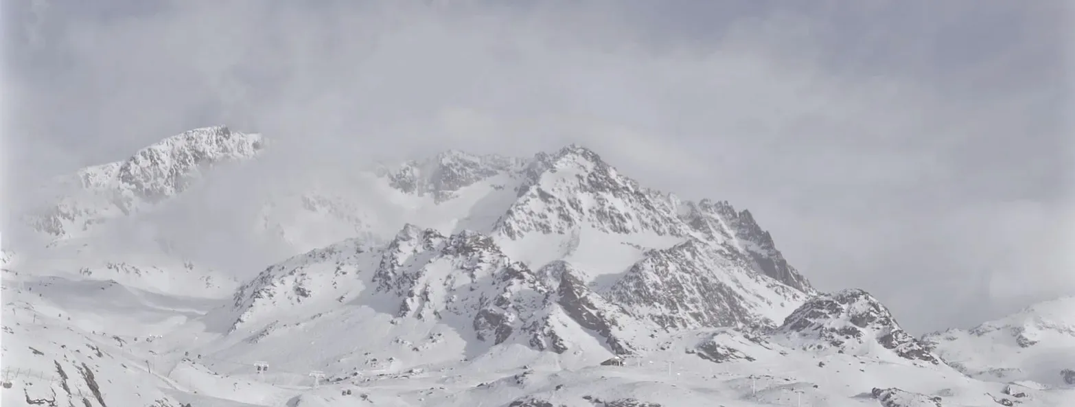 Alpine mountain range covered in snow