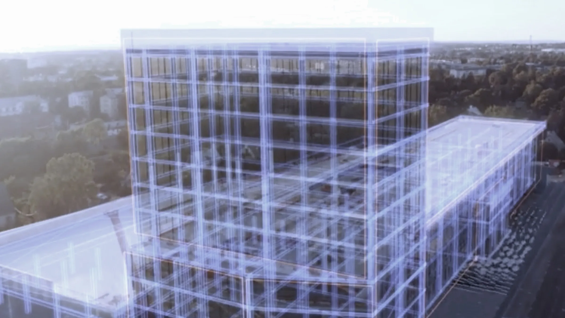 Wireframe of a data centre building over an aerial site photograph
